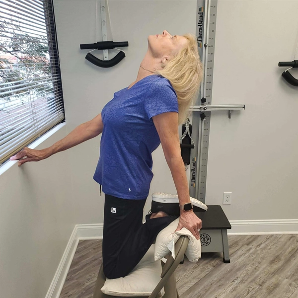 Woman stretching at Gateway to Health Chiropractic